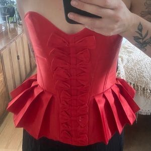 Red corset with bows and pleated waist